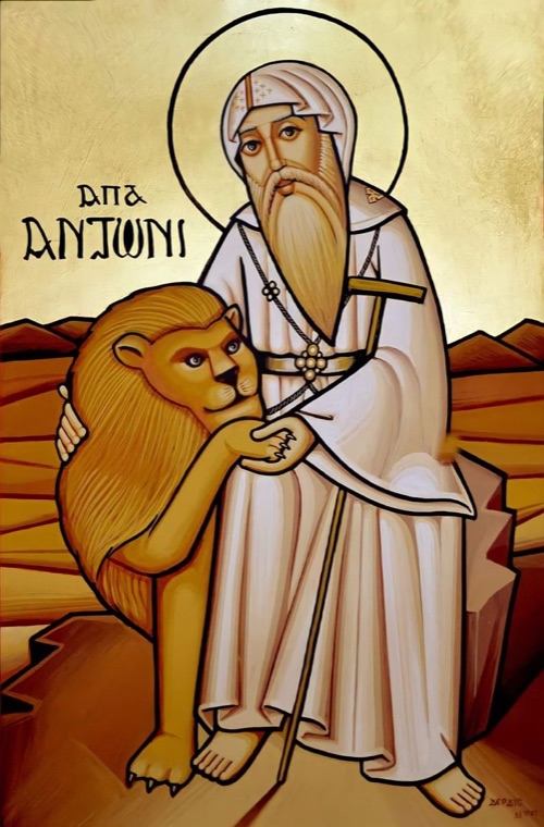 Coptic icon of St. Anthony the Great with a lion in the desert